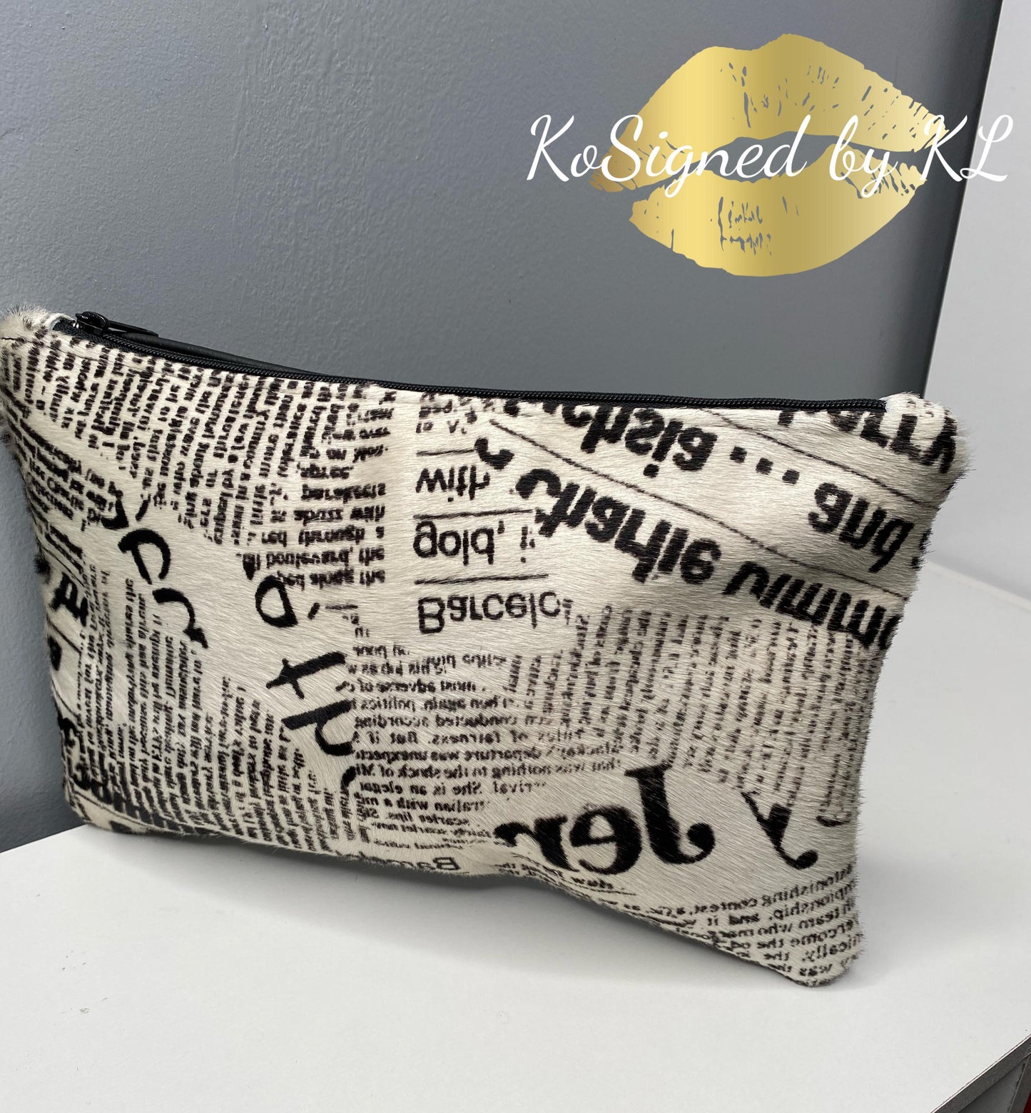 News Paper Cowhide Clutch